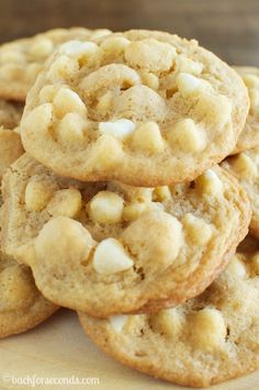 white chocolate chip cookies stacked on top of each other