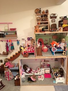 a doll house filled with lots of dolls and furniture