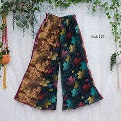 Vintage Kantha Bohemian Trousers with Pockets, Upcycled Clothing, Boho Palazzo Pants, Hippie Style, 70s Outfit , Quilt Pants, One of a Kind  Kantha is a type of embroidery originating from the Indian subcontinent, specifically from the regions of Bangladesh and West Bengal in India. It is characterized by running stitches that are often used to repurpose old saris and fabrics into new unique and colorful pieces These Vintage Kantha Bohemian Trousers with Pockets are stylish, handstitched trousers crafted with handmade Kantha fabric. They have a 70s-inspired palazzo style and come in an airy, loose fit for ultimate comfort. With two side pockets, these trousers are perfect for everyday use while still encompassing boho style, and they are sustainably crafted with cotton. Due to the handmade Multicolor Cotton Wide Leg Hippie Pants, Vintage Wide Leg Patchwork Pants, Bohemian Multicolor Wide Leg Trousers, Retro Multicolor Pants For Festival, Retro Multicolor Patchwork Pants, Hippie Style Multicolor Wide-leg Pants, Hippie Style Multicolor Wide Leg Pants, Hippie Multicolor Wide-leg Pants, Bohemian Multicolor Straight Pants