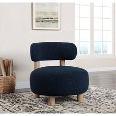 a blue chair sitting on top of a rug