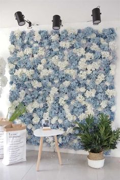 the wall is covered with blue and white flowers