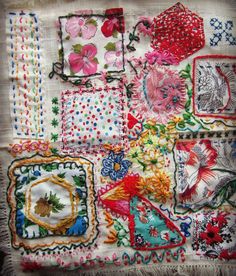 an embroidered cloth with many different designs on it