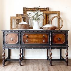 an antique dresser with two baskets on top