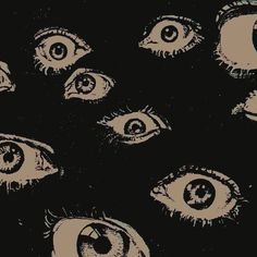 an image of many different eyes in the dark