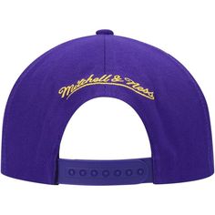 Step out in groundbreaking style with this Los Angeles Lakers Earthquake hat. This Mitchell & Ness headwear features throwback team graphics shattering through the bold design. With a snapback closure for a perfect fit, this cap will give any Los Angeles Lakers outfit an earthmoving finish.Step out in groundbreaking style with this Los Angeles Lakers Earthquake hat. This Mitchell & Ness headwear features throwback team graphics shattering through the bold design. With a snapback closure for a pe Purple Snapback Hat For Streetwear, Adjustable Purple Baseball Cap For Sports, Throwback Adjustable Baseball Cap For Fans, Adjustable Snapback Hat With Team Logo, Sports Fan Snapback Hat With Curved Brim For Streetwear, Throwback Trucker Hat For Streetwear, Adjustable Sports Fan Snapback Hat For Streetwear, Adjustable Snapback For Sports Fans, Adjustable Team Logo Hat For Streetwear