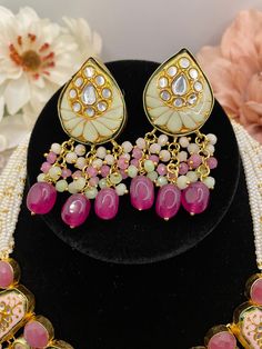 The necklace comes with earrings to match and is a beautiful Rajasthani set to complement any outfit. It is hand painted and is in a beautiful pastel finish with kundan stone work. Pink Kundan Necklace With Mirror Work, Handmade Pink Kundan Necklace, Handmade Pink Kundan Necklace For Festivals, Handmade Pink Temple Jewelry Sets, Handmade Pink Chandbali Kundan Necklace, Traditional Handmade Pink Kundan Necklace, Traditional Pink Handmade Kundan Necklace, Pink Kundan Necklace With Cutdana, Pink Kundan Jewelry Set With Meenakari