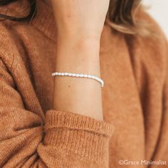 "🎁SUMMER SALE: ADD 2 ITEMS TO CART AND GET 60% OFF!  ENTER CODE: SUMMER60 AT CHECKOUT! Experience the allure of our Delicate Mini Pearl Bracelet. It's subtle pearls and minimalist design effortlessly complement any ensemble. Embrace its solo charm or layer for a captivating statement. H O W ∙ T O ∙ O R D E R 1.Select options from the menu ( Finish) 2.Add to cart and proceed to checkout I T E M ∙ S P E C I F I C A T I O N S * Material: High Quality Solid 925 Sterling Silver * Finish: 18K Gold  * White Beaded Braided Bracelets For Everyday, Everyday White Beaded Braided Bracelets, Everyday White Beaded Braided Bracelet, White Beaded Bracelets For Bridesmaid Gift, White Beaded Bracelet For Bridesmaid Gift, Hypoallergenic White Braided Bracelets As Gift, White Dainty Beaded Bracelets For Bridesmaid Gift, Minimalist Adjustable Beaded Bracelet For Bridesmaids, Dainty White Beaded Bracelets For Bridesmaids