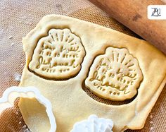 two cookie cutters and some dough on a table