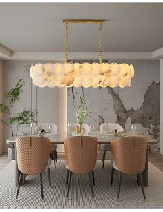 a dining room table with chairs and a chandelier hanging from it's ceiling