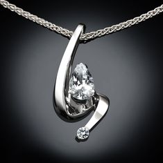 "Cubic Zirconia Necklace - Argentium Silver - 3380 - Argentium Chain Included A contemporary, yet timeless design by award winning designer, David Worcester. This Argentium 960 high purity silver pendant measures 1 1/8 x 1/2 inches (29 x 13mm) and holds a 9X6mm pear shape CZ and a 3.5mm CZ. ( IMPORTANT - PLEASE READ 1. AND 2 BELOW ) 1.) INCLUDED IN THE PRICE IS AN ARGENTIUM SILVER CHAIN APPROPRIATE FOR THE PENDANT CHOSEN. YOU CAN CHOOSE FROM 16\", 18\" OR 20\" LENGTH AT CHECKOUT. 2.) PLEASE LOOK Jewellery Hangers, Swiss Blue Topaz Necklace, White Sapphire Necklace, Alexandrite Necklace, Yucca Valley, Blue Sapphire Pendant, Blue Sapphire Necklace, Fine Gold Jewelry, Necklace Organizer