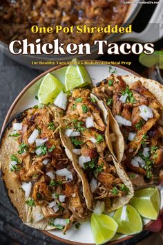 one pot shredded chicken tacos on a plate with lime wedges