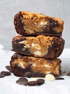 three brownies stacked on top of each other with chocolate chips and marshmallows