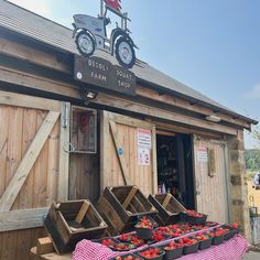 an old fashioned farm shop with fresh strawberries for sale