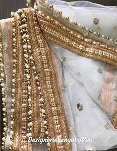 Custom made net dupatta perfect for all festive and wedding occasions.Length- 2.50 metersCan also be used for gifting purposes in wedding parties and mehendi & haldi ceremonies.Manufacturing time- 4 daysQuality 100% guaranteed. Gold Organza Lehenga With Dori Work, Gold Organza Choli With Sheer Dupatta, Gold Anarkali Choli With Sheer Dupatta, Gold Bollywood Choli With Sheer Dupatta, Anarkali Style Gold Choli With Sheer Dupatta, Gold Choli With Sheer Dupatta In Organza, Gold Organza Lehenga For Festivals, Festival Gold Organza Lehenga, Festive Wedding Sharara With Mirror Work