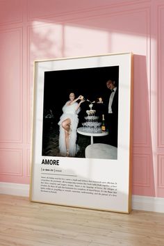 a framed photograph of a woman in a white dress standing next to a table with a cake on it