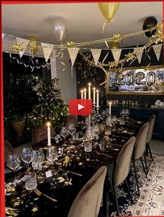 a dining room table is set with candles and decorations for a new year's eve celebration