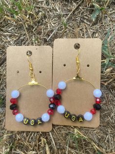 UGA glass bead earrings with black and gold letter beads. Earring diameter is 1.57 inches and these earrings hang almost 2 inches from earlobe. Glass Bead Earrings, Gold Letter, Letter Beads, Gold Letters, New Mothers, Baby Name, Bead Earrings, How To Make Beads, Glass Bead