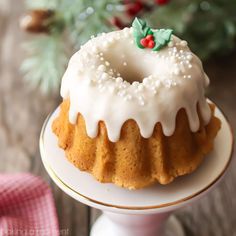 a bundt cake with icing and sprinkles sitting on a plate