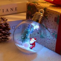 a glass ornament with a christmas tree inside