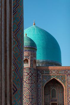 an ornate building with a blue dome on top