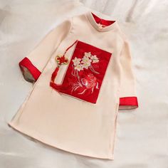 This beautiful modern ao dai set is perfect for any special occasion: Lunar New Year, Mid Autumn Festival, Attending a Wedding, or a Family photoshoot. 🌿 This set includes an Ao Dai top and No pants. Style: Traditional Material: Very well made with high-quality silk suitable for skin kid Collar: 1.5 cm Please provide bust-waist-and hip measurements when placing your order to ensure the best fit for you. 🌿 NOTE: * Recommend gentle washing * Please contact us for any inquiries about size. We don Embroidered Long Sleeve Ao Dai For Ceremony, White Embroidered Ao Dai For Wedding, White Ao Dai For Festive Occasions, Embroidered Sets For Spring Traditional Ceremonies, Festive White Embroidered Ao Dai, Traditional White Ao Dai With Floral Embroidery, Festive Embroidered White Ao Dai, Wedding Embroidered Sets With Stand Collar, Spring Wedding Embroidered Cheongsam