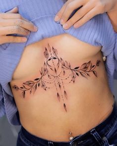 a woman with a tattoo on her stomach