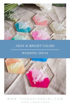 wedding favors with the words neon and bright colors on them, sitting on a table