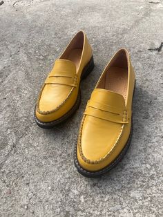 "Women Penny loafers are a timeless classic in womens footwear. Our womens classic loafers come in yellow leather, making them a versatile addition to any wardrobe. These shoes are not only stylish, but also practical, with a sturdy rubber sole that provides excellent grip and durability. Whether you're dressing up for work or going out for a casual weekend, these penny loafers are the perfect choice. The elegant yellow leather pairs well with any outfit, making them a truly versatile shoe. And with their comfortable fit and removable soft insole, you can wear them all day without worrying about your feet getting tired. Investing in a pair of black penny loafers is a smart choice that will last you for years to come. So why not treat yourself to a pair of our women's classic loafers today? Yellow Loafers, Yellow Shoes Flats, Womens Penny Loafers, Classic Loafers, Womens Loafers, Womens Footwear, Leather Making, Classic Women, Yellow Shoes