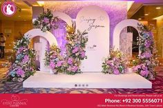 an advertisement for a wedding venue with flowers on the stage