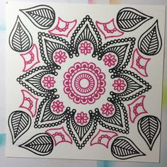 a drawing with black and pink designs on white paper