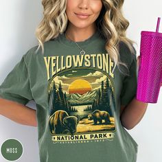 "Celebrate Yellowstone's famous wildlife and its majestic mountains with our Yellowstone National Park Shirt! This custom design shirt is all about embracing the great outdoors. It features the beautiful Montana and Wyoming landscape, complete with the iconic Buffalo and Grizzly Bear, which the park is known so well for. The Comfort Colors 1717 garment-dyed tee has a comfy, lived-in feel that is perfect for hiking, camping, or wherever your day may take you. Get yours today and hit the trail! PLEASE NOTE This is a standard unisex size Comfort Colors Tee. For an oversized tee, please size up. If you are looking for an oversized \"T-shirt Dress\" look, we recommend sizing up 2 sizes. Please review the size chart to ensure you receive the fit you want.---Unisex Crew Neck----- *Product Descrip Casual Graphic Print Camp Shirt For Hiking, Summer Graphic Print Shirt For Hiking, Summer Graphic Print Shirt For Outdoor, Wyoming Landscape, Montana Shirt, Buffalo Shirt, National Park Gifts, National Park Shirt, Custom Design Shirts