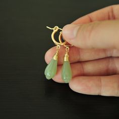 "I've always been passionate about the combination leveraging tranditional Asian jewelry materials. The ancient flower nephrite green jade and the gold color (top quality gold filled hoop), the classical design that is never out of the style. Enjoy, I really hope you like them. About this Earrings: Condition: Brand new Earring wire: 14K gold filled  Materials: Icy nephrite jade Color : Green Approximate earring length: 39MM, 1.5\" Approximate Hoop Earring size: 13MM, 0.51\"" Yellow Gold Jade Earrings, Elegant Jade Hoop Earrings, Handmade Jade Hoop Earrings As Gift, Yellow Gold Jade Drop Earrings, Adjustable Jade Jewelry With Ear Wire, Adjustable Jade Earrings With Ear Wire, Elegant Nickel-free Chrysoprase Jewelry, Dainty Green Hoop Jewelry, Green Dainty Hoop Jewelry