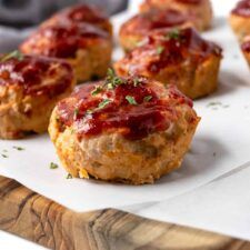 mini meatloaf muffins with ketchup and parsley on top