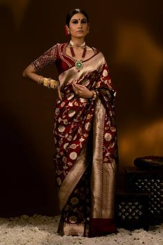 Dark red banarasi silk saree with all over gold, orange zari handwoven floral jaal pattern and vintage pattern broad border. Components: 1 Pattern: Handwoven Type Of Work: Floral Jaal and Vintage Pattern Fabric: Banarasi Silk Color: Red Other Details:  Approx. Length: 5.5 mtrs Note: The stitched blouse worn by the model is not for sale Occasion: Wedding,Bride - Aza Fashions Red Saree Blouse, Saree Blouses Online, Bengali Bride, Bridal Lehenga Red, Padded Blouse, Simple Sarees, Embroidered Sleeves, Sequin Blouse