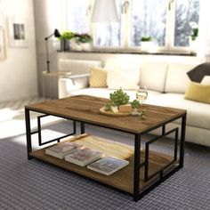 a coffee table with magazines on it in a living room