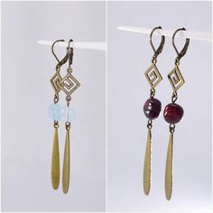 Experience the allure of timeless elegance with these unique handmade earrings from Estibela Design, where vintage charm meets contemporary sophistication. Crafted with a rich bronze finish, these earrings showcase a perfect blend of antique style and modern design, ideal for those who appreciate exquisite and original accessories. The meticulously designed hooks gracefully support natural stones, either a deep garnet or a clear aquamarine, each selected to enhance your look with their inherent Elegant Handmade Brass Chandelier Earrings, Elegant Handmade Bronze Chandelier Earrings, Unique Handmade Earrings, Bronze Earrings, Aquamarine Stone, Unique Handmade Jewelry, Antique Style, Bronze Finish, Vintage Charms