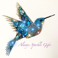 there is a blue bird made out of beads