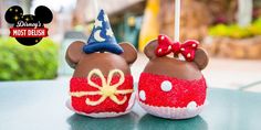 two mickey mouse cake pops are decorated with red, white and blue icing