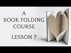 an open book with the words a book folding course lesson 2 on top of it