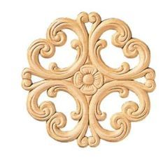 an intricately carved wooden design on a white background, with the center piece cut out