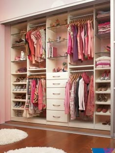 an organized closet with pink walls and white carpeted flooring in a child's bedroom