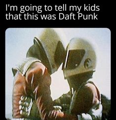 two people wearing helmets and holding hands with the caption, i'm going to tell my kids that this was daft punk