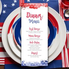 a place setting with plates, silverware and red white and blue napkins on it