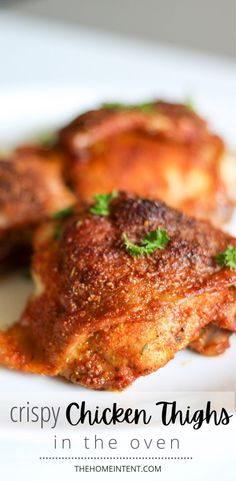 crispy chicken thighs in the oven on a white plate