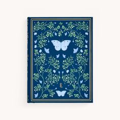 a blue book with butterflies and flowers on it