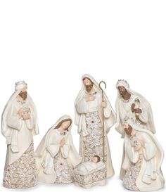 three nativity figurines in white and gold