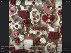 some cookies are arranged on a table with flowers and other things in the shape of hearts