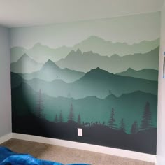 a room with mountains painted on the wall