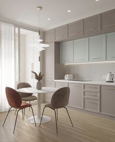 a dining room table and chairs in front of a kitchen with white cupboards on the wall