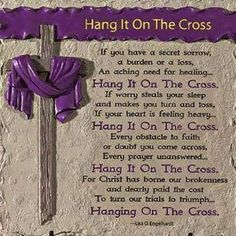 a stone plaque with a purple ribbon on it that says hang it on the cross